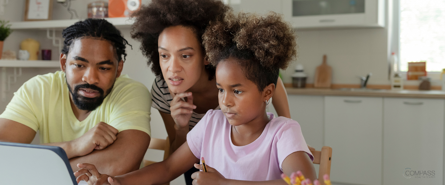 Parents with their child reading about possible mental health care solutions 